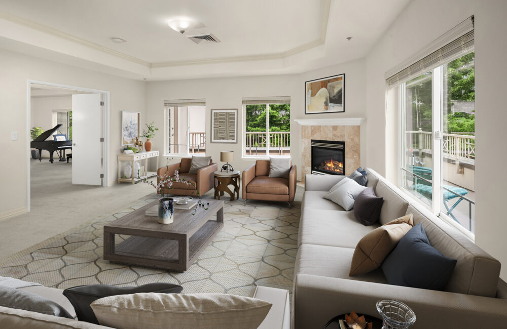 University House Issaquah retirement community apartment living room with fireplace