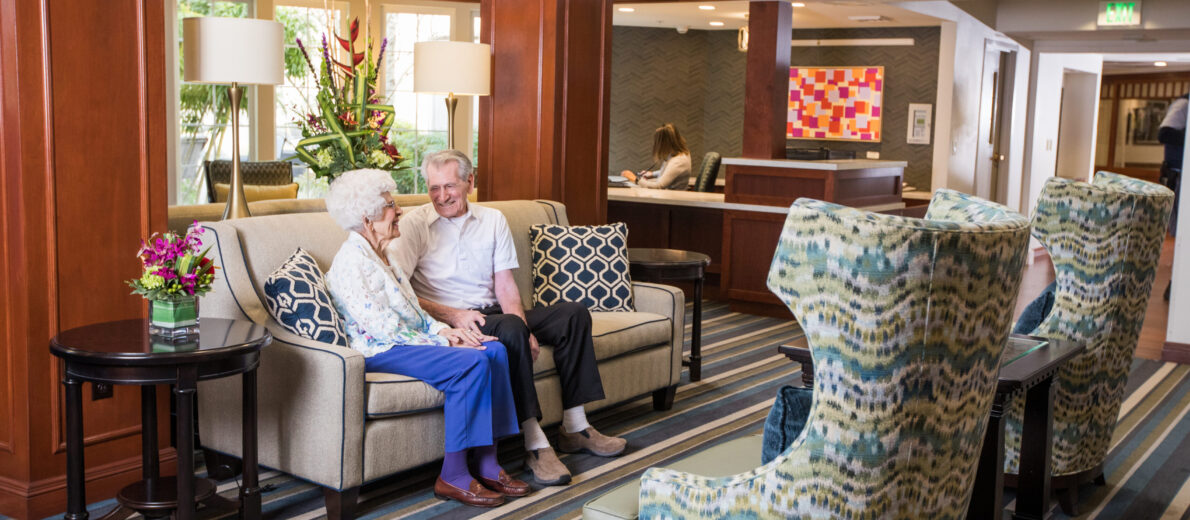 Couple sitting in front lobby