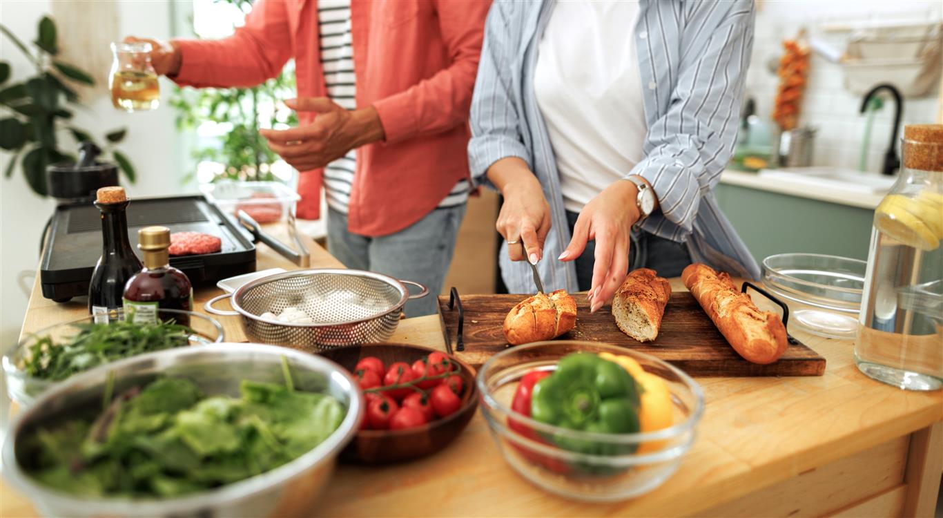Couple creating a summerttime favorite meal