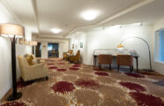 Puzzle table and cozy living area at University House Issaquah retirement community