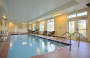 swimming pool and jacuzzi with big windows and natural lighting