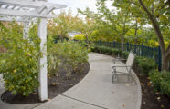 Garden walkway with bench at retirement community