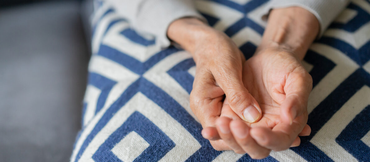 close up of a woman massaging hand