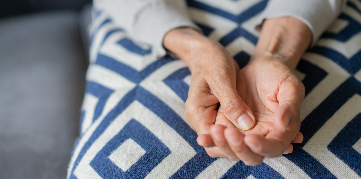 close up of a woman massaging hand