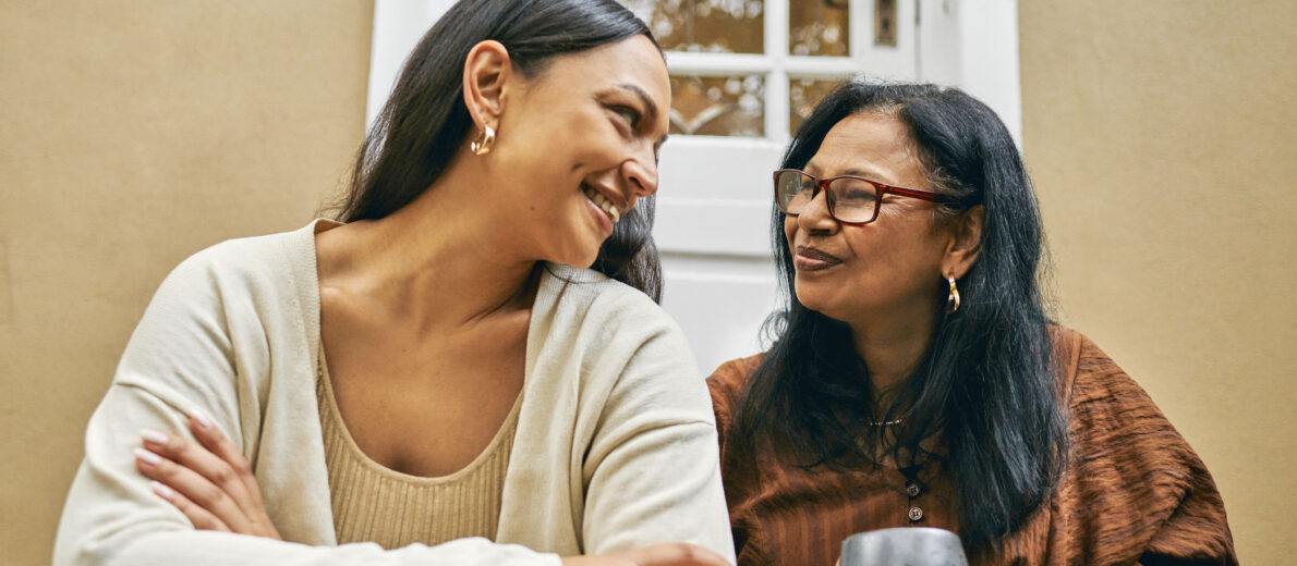 Happy mother and daughter having conversation