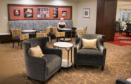 Senior woman perusing menu in a cafe in Seattle retirement living home.
