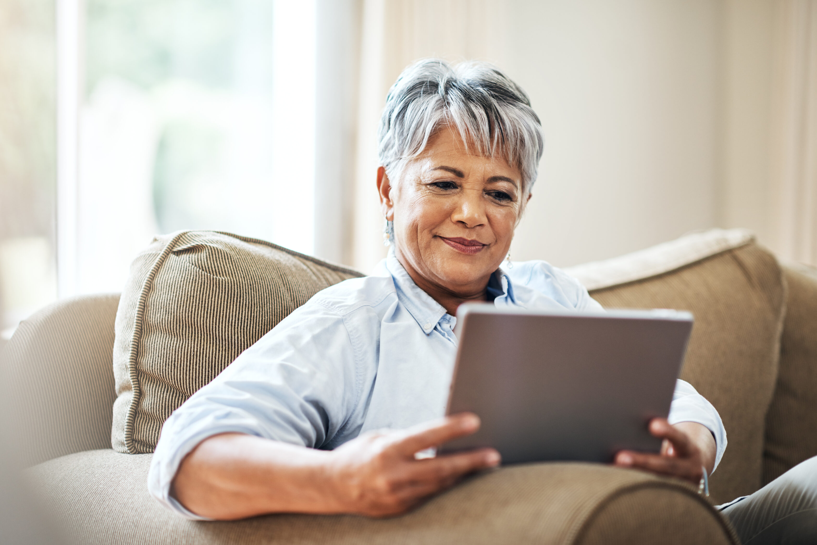 Older woman evaluating various options online